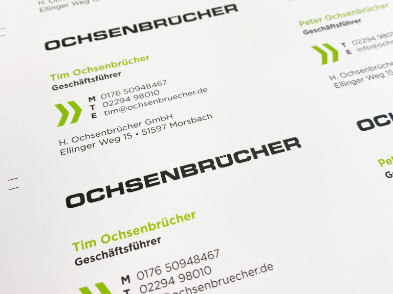 Visitenkarte der H. Ochsenbrücher GmbH mit Kontaktdaten von Tim und Peter Ochsenbrücher, Geschäftsführern, sowie Adresse und Telefonnummern für geschäftliche Anfragen.